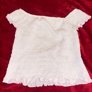 white ruffled of the shoulder top